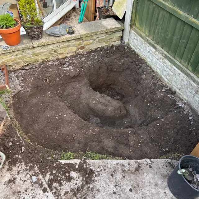 The finished dig showing the staircase-like stepped depths, with a ramp between each level.